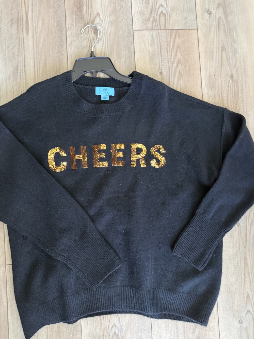 CeCe Black Crewneck Sweater with Gold Sequin "CHEERS"
